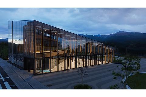 Side view of a building in Woven City that uses glass as a main feature
